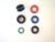 Fuel Injector Components: From Top Left, clockwise:
3-138 - Insulator, Import
3-015 - O-ring, 15 mm Red
3-271 - O-ring, 14.5 mm Blue
3-108 - O-ring, 14.5 mm Black
3-144 - O-ring, 11.5 mm Green
3-140 - Lower seal, import, 16mm