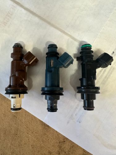 New generation injector upgrade (shown on right) replaces the OEM injectors (shown on left and center).